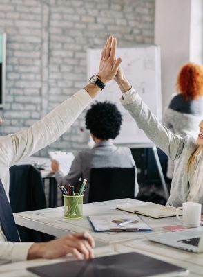 happy-business-people-supporting-each-other-giving-high-five-office-scaled-qpsa24fw1gatiialdiybqvkm5n8wu344l2zw41a49s